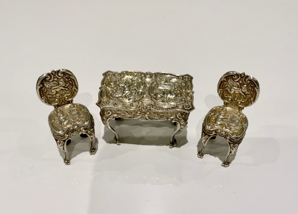 Miniature silver table and chairs