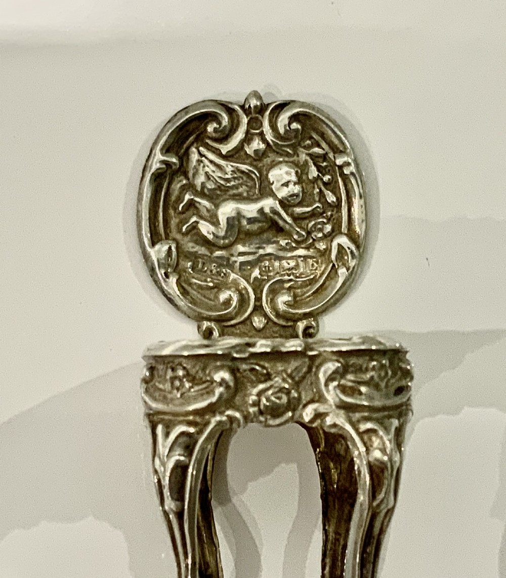 Miniature silver table and chairs View IV