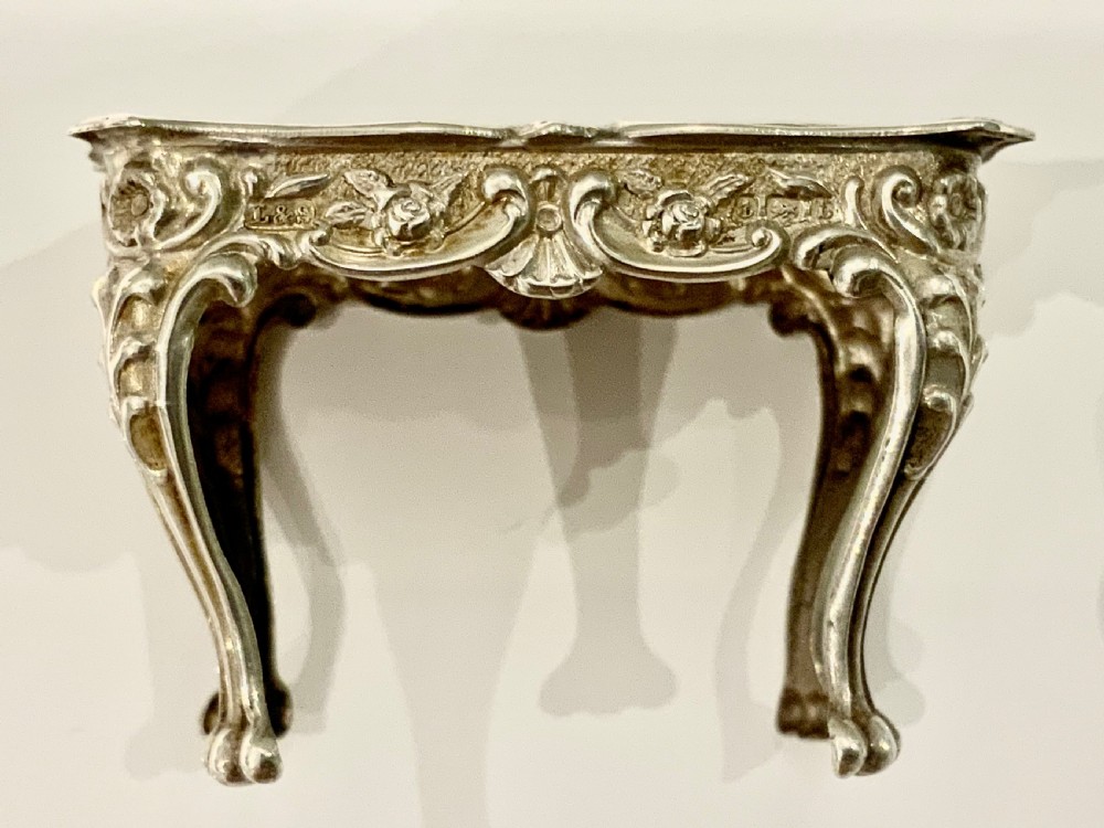 Miniature silver table and chairs View V