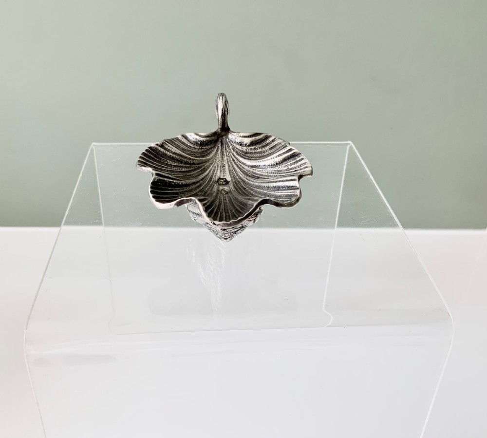 A silver salt cellar fashioned in the shape of a swan with detailed feather texture and a ribbed shell-shaped dish on its back. View IV