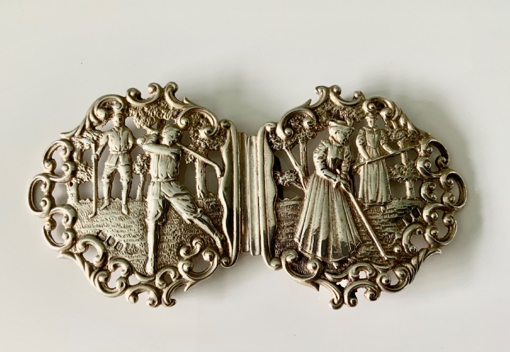 Silver buckle - golfing interest