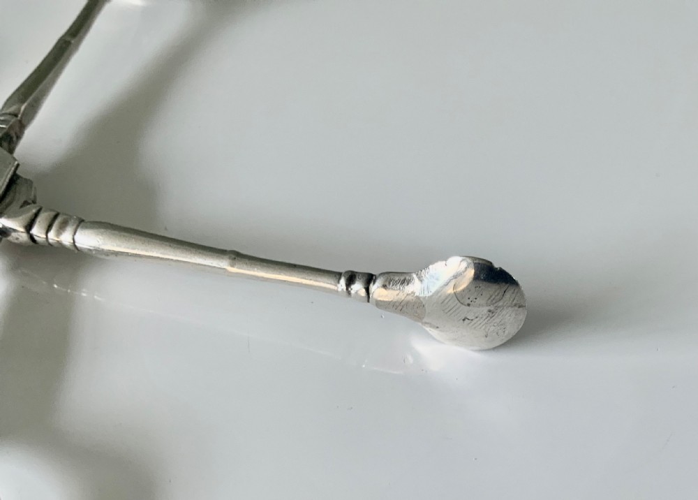 Early Baluster pair of silver tea tongs View V