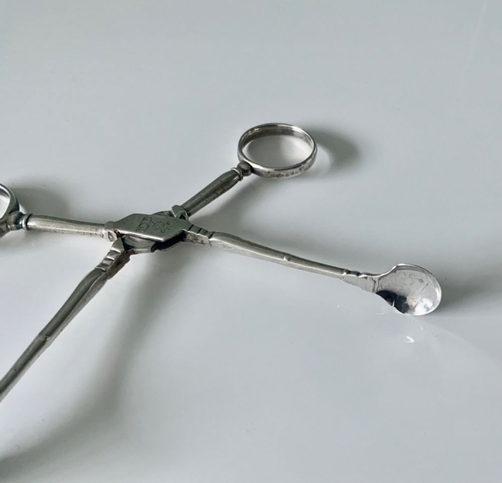 Early Baluster pair of silver tea tongs View VI