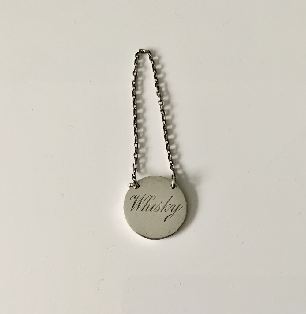 Art deco silver Whisky label