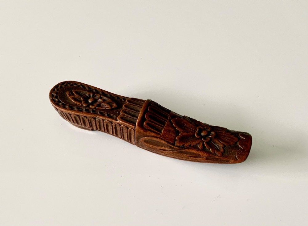 Carved wooden shoe needle case