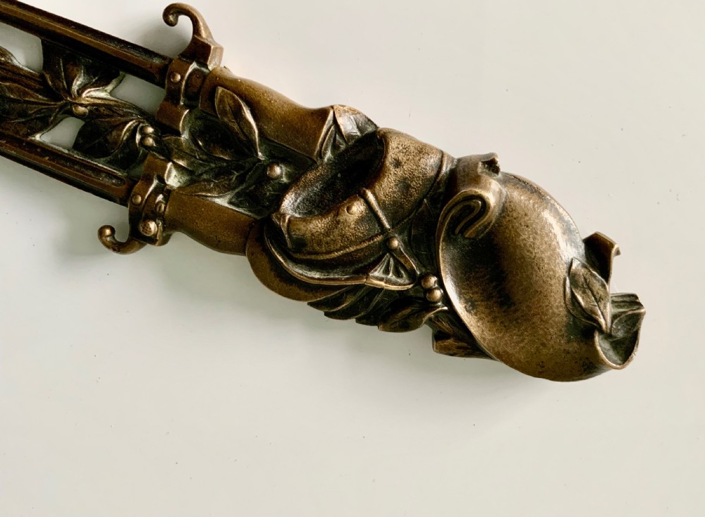 A French gilt bronze letter opener featuring pierced leaf motifs and a sculpted foliage handle. View II