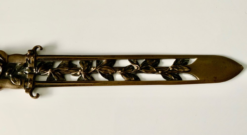 A French gilt bronze letter opener featuring pierced leaf motifs and a sculpted foliage handle. View III