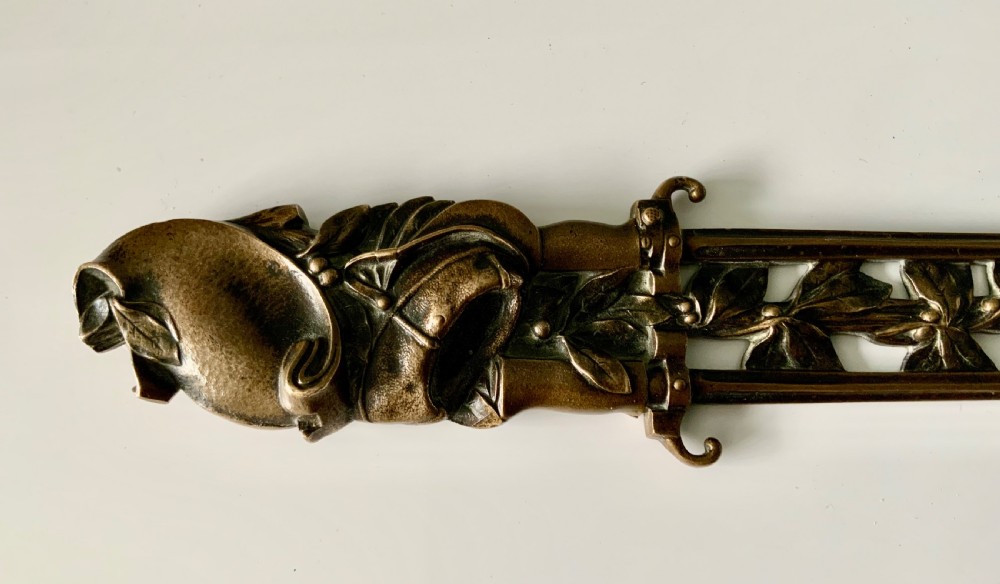 A French gilt bronze letter opener featuring pierced leaf motifs and a sculpted foliage handle. View IV