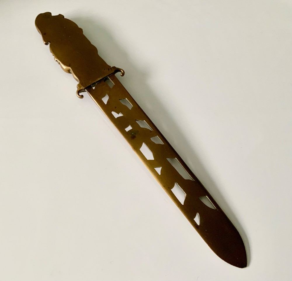 A French gilt bronze letter opener featuring pierced leaf motifs and a sculpted foliage handle. View V