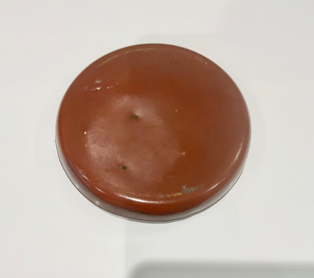 An antique round bronze tray featuring two cold painted dog figures affixed to the interior surface. View VI