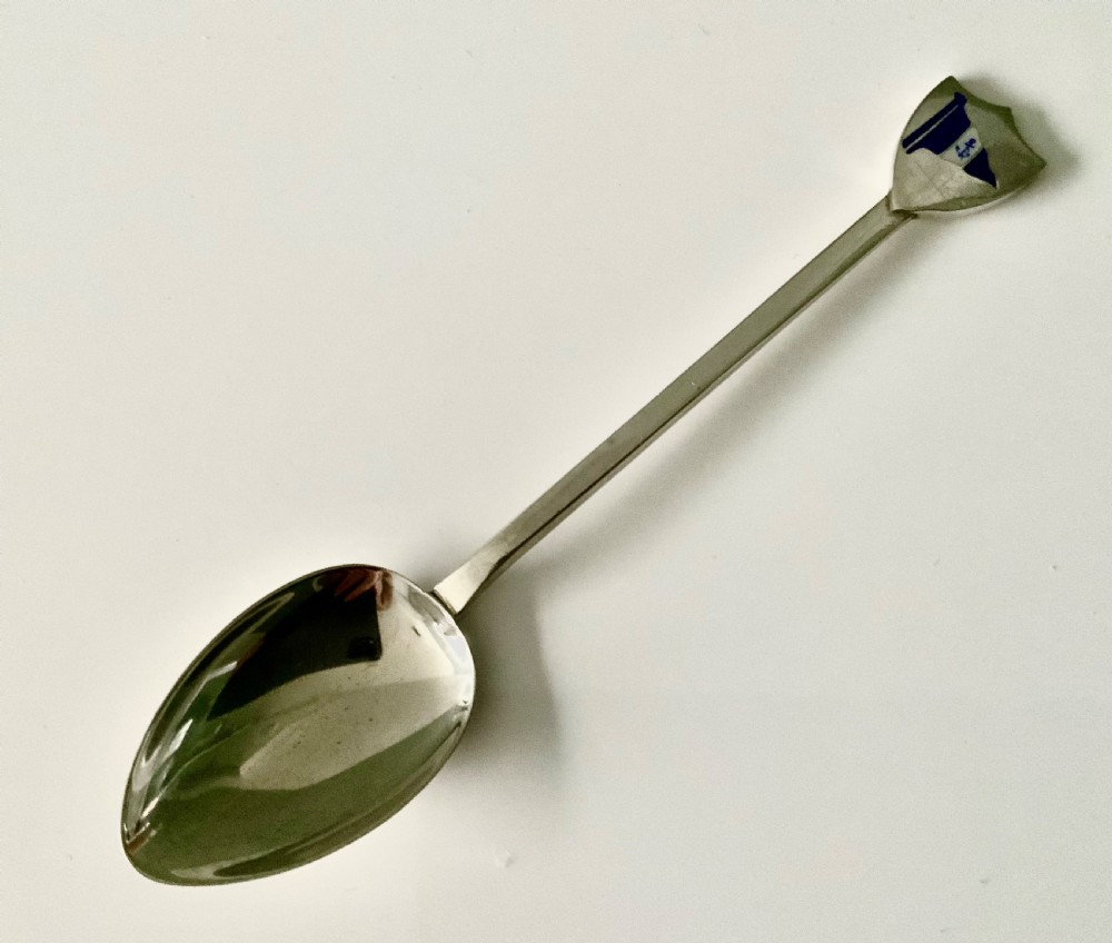 A set of six silver teaspoons with blue and white enamel sailing club flags on shield finials, housed in a blue satin-lined presentation case. View II