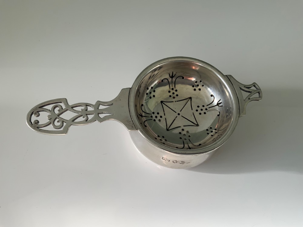 Silver tea strainer & bowl