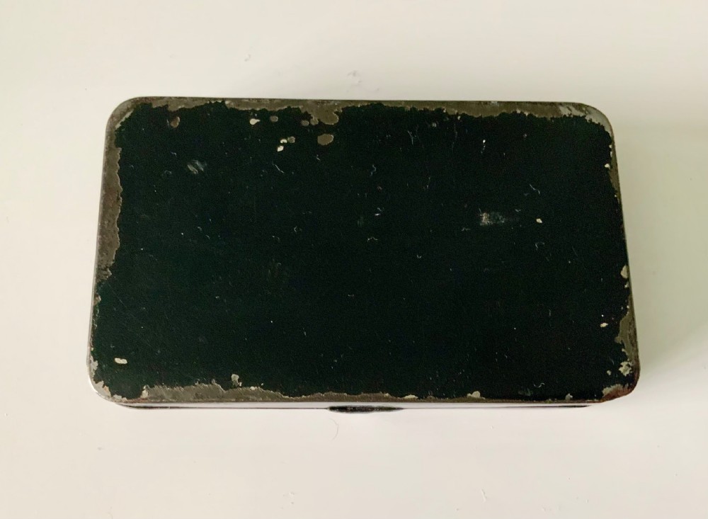 An early 19th-century rectangular painted tin snuff box featuring a hand-painted portrait of a bearded man on the olive green lid. View III