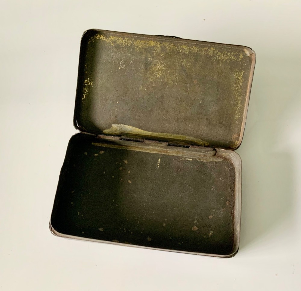 An early 19th-century rectangular painted tin snuff box featuring a hand-painted portrait of a bearded man on the olive green lid. View IV