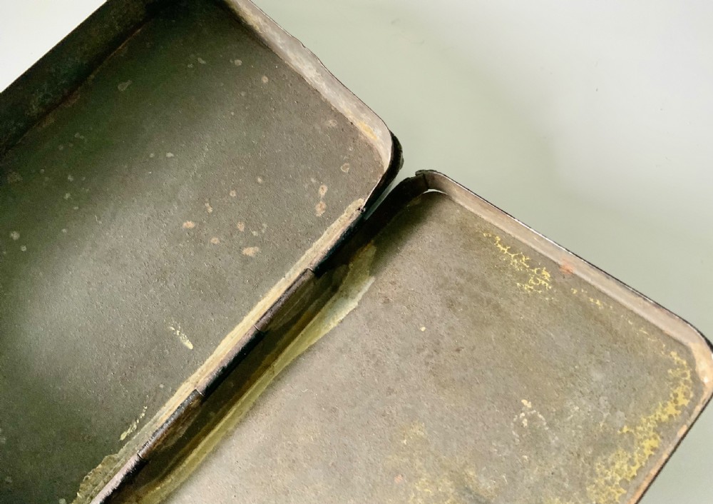 An early 19th-century rectangular painted tin snuff box featuring a hand-painted portrait of a bearded man on the olive green lid. View V