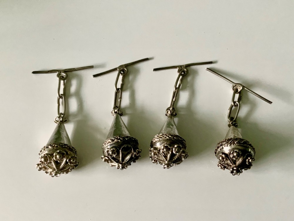 Four 19th-century Maltese silver filigree spherical buttons with attached chain links and toggle bars. View II