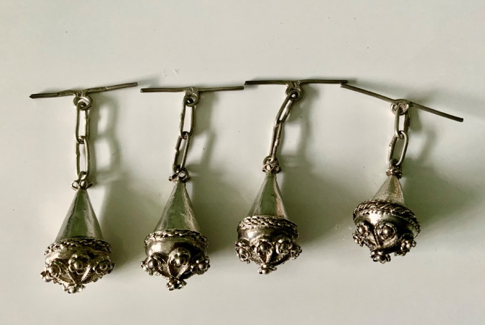 Four 19th-century Maltese silver filigree spherical buttons with attached chain links and toggle bars. View III