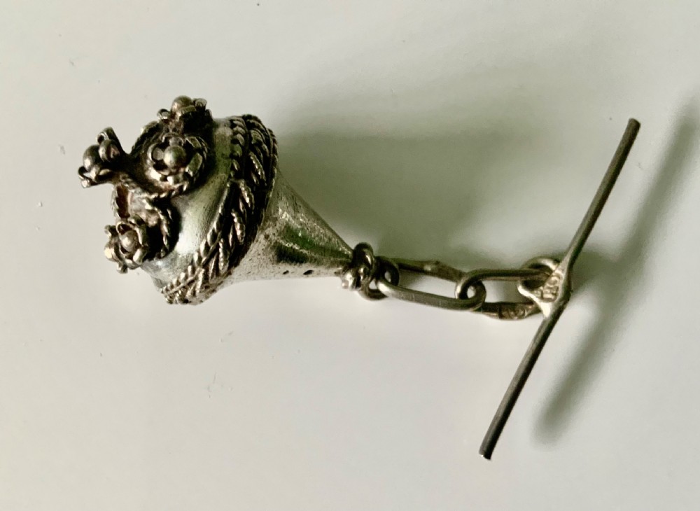 Four 19th-century Maltese silver filigree spherical buttons with attached chain links and toggle bars. View IV