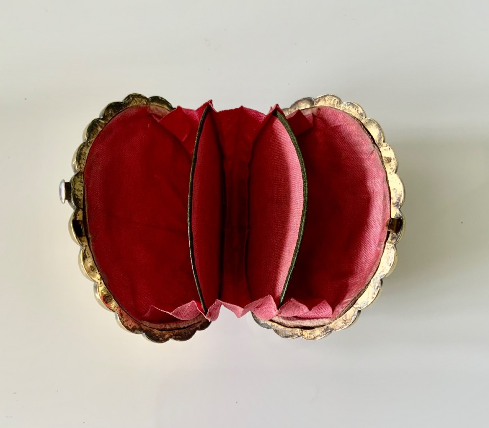 A 19th-century French silver gilt shell-shaped coin purse resting inside its open original fitted presentation box lined with cream silk. View III