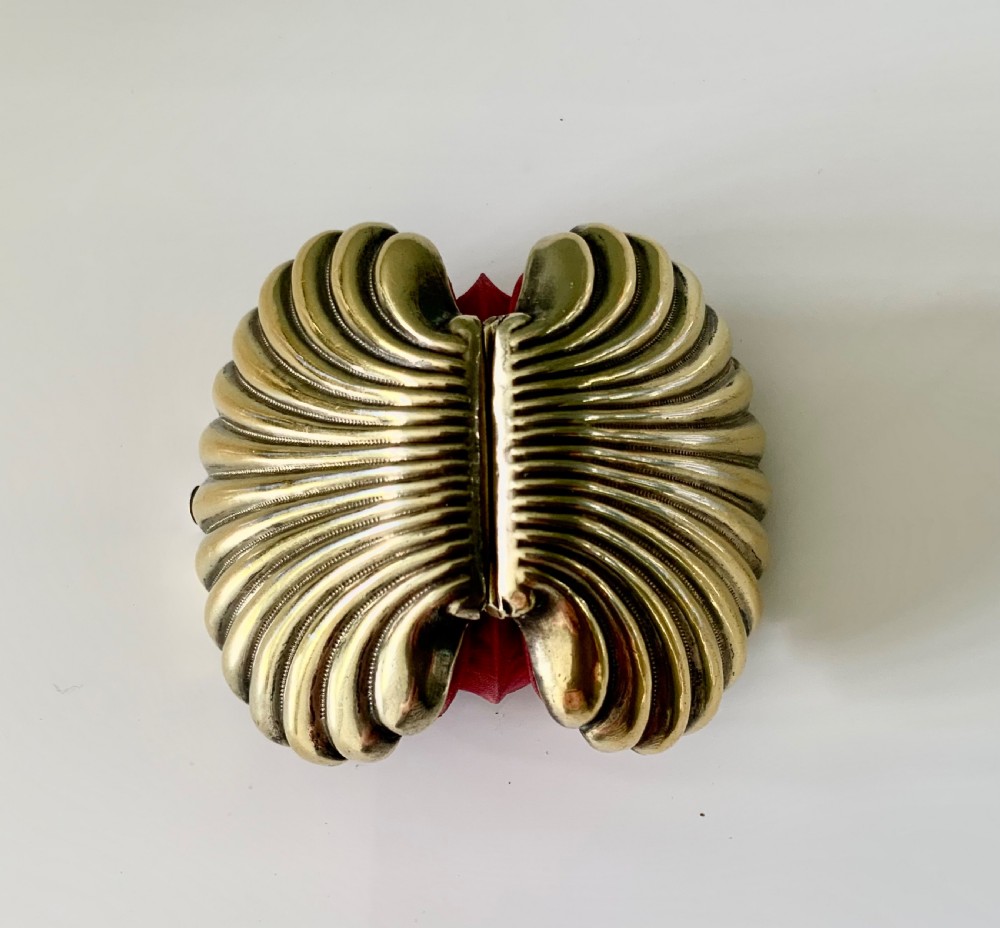 A 19th-century French silver gilt shell-shaped coin purse resting inside its open original fitted presentation box lined with cream silk. View IX