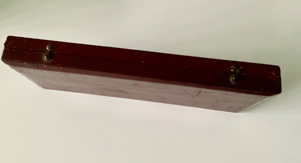 A three-piece Georgian silver cutlery set in the Coburg pattern, presented inside a velvet-lined display case. View VII