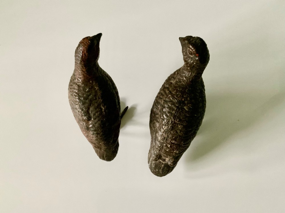 A pair of small, detailed cold-painted bronze figures depicting standing grouse birds with textured feathering. View III