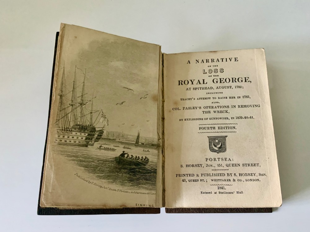 An open nineteenth-century book showing an engraved frontispiece illustration of a ship sinking on the left and a printed title page titled A Narrative of the Loss of the Royal George on the right.