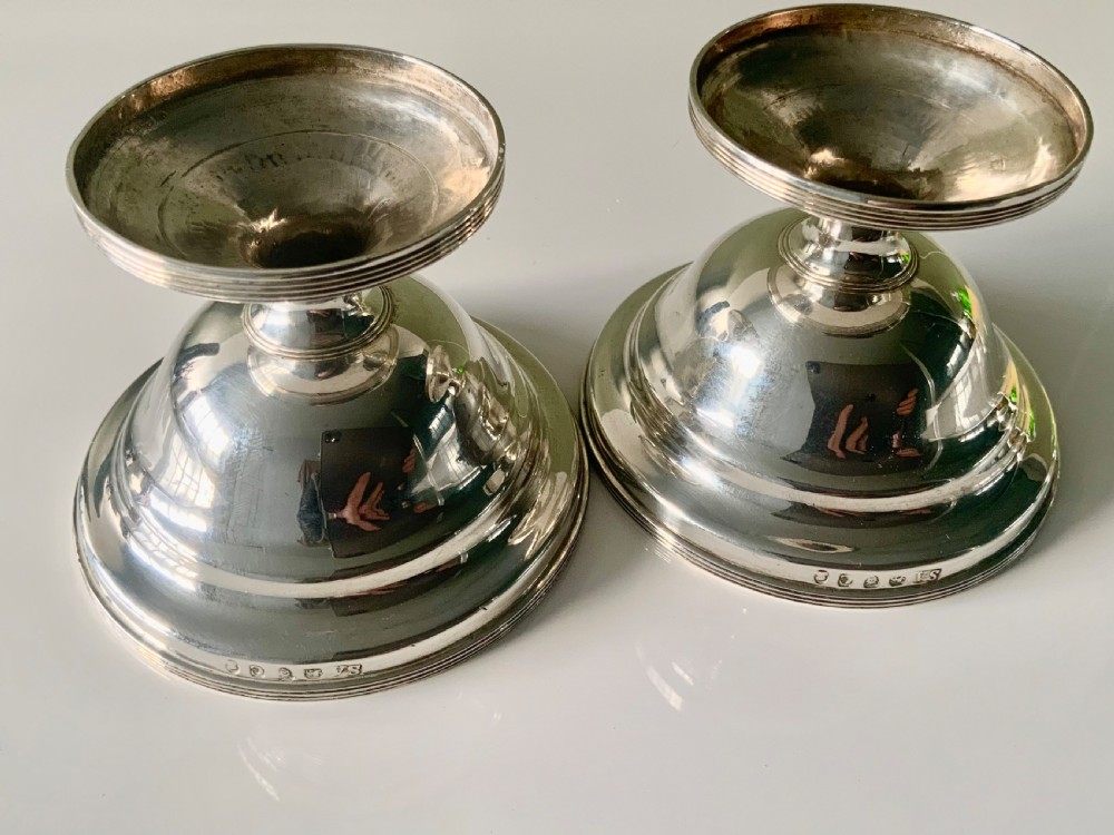 A pair of polished silver pedestal dishes featuring stepped circular bases and interior gold-gilded bowls. View III
