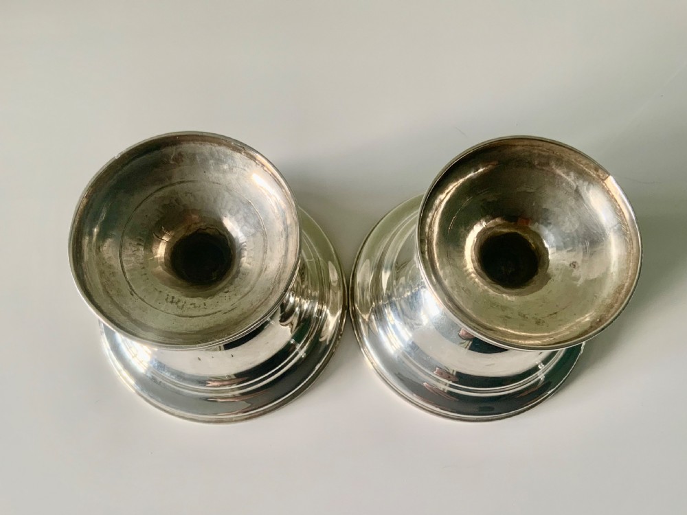 A pair of polished silver pedestal dishes featuring stepped circular bases and interior gold-gilded bowls. View IV