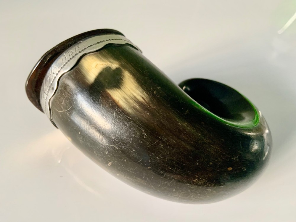 A nineteenth-century Scottish horn snuff mull featuring a curled natural horn body topped with engraved silver mounts and a hinged lid. View V