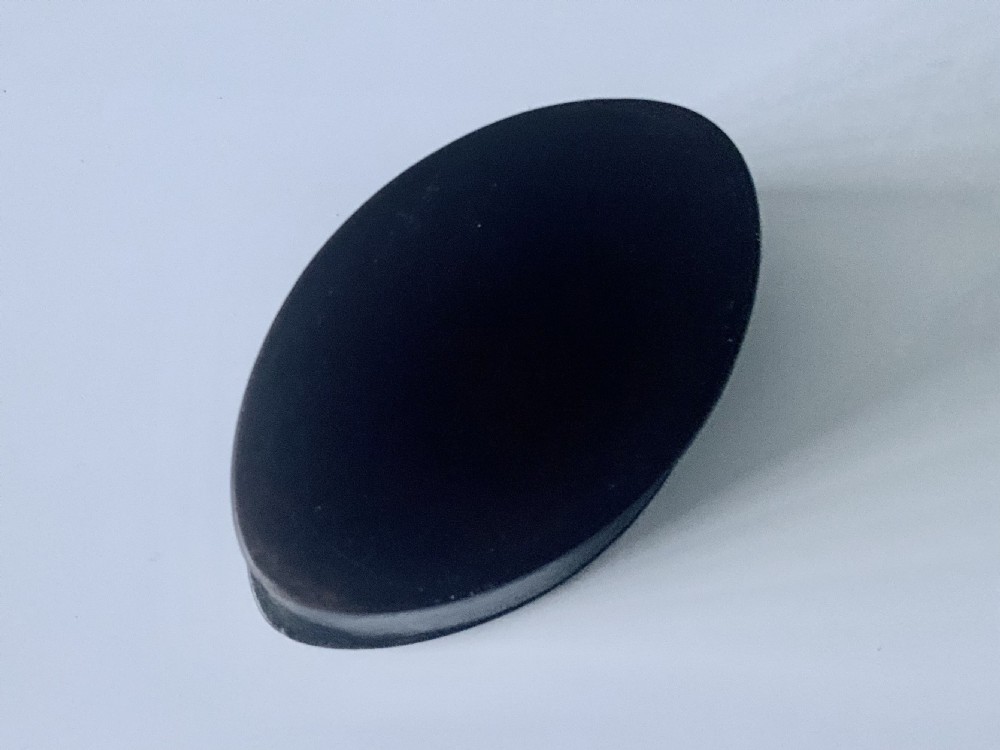 An oval dark brown leather Georgian snuff box featuring an engraved silver monogram cartouche on the lid. View III