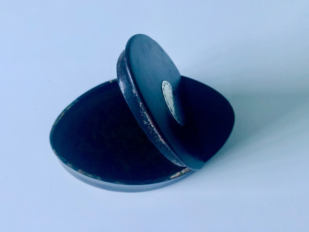 An oval dark brown leather Georgian snuff box featuring an engraved silver monogram cartouche on the lid. View IV