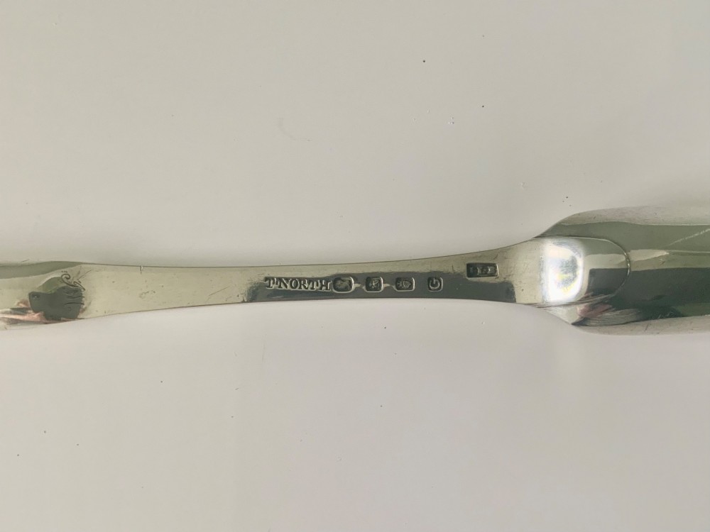 An antique double-ended sterling silver marrow scoop featuring two elongated trough-shaped bowls of differing widths connected by a narrow central shank. View III