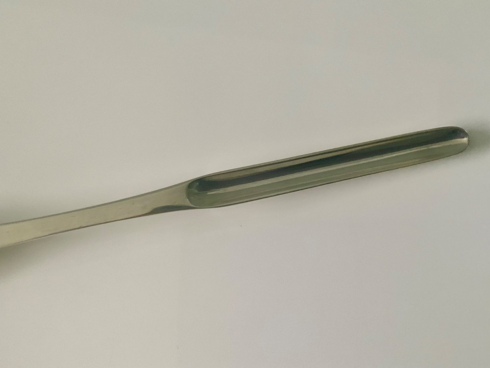 An antique double-ended sterling silver marrow scoop featuring two elongated trough-shaped bowls of differing widths connected by a narrow central shank. View V