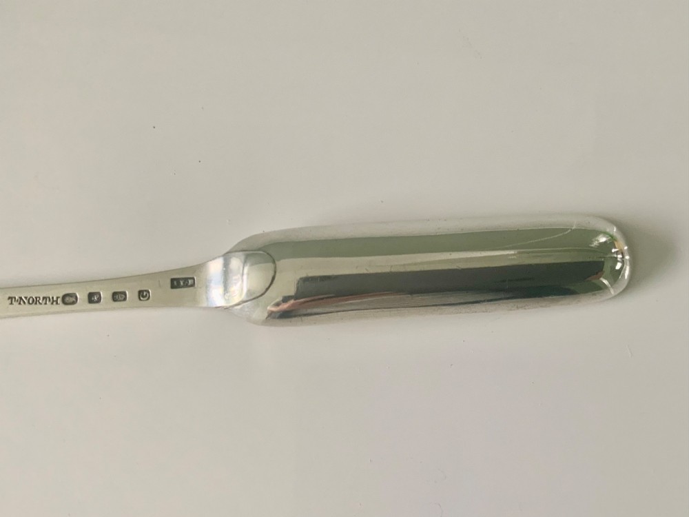 An antique double-ended sterling silver marrow scoop featuring two elongated trough-shaped bowls of differing widths connected by a narrow central shank. View VI