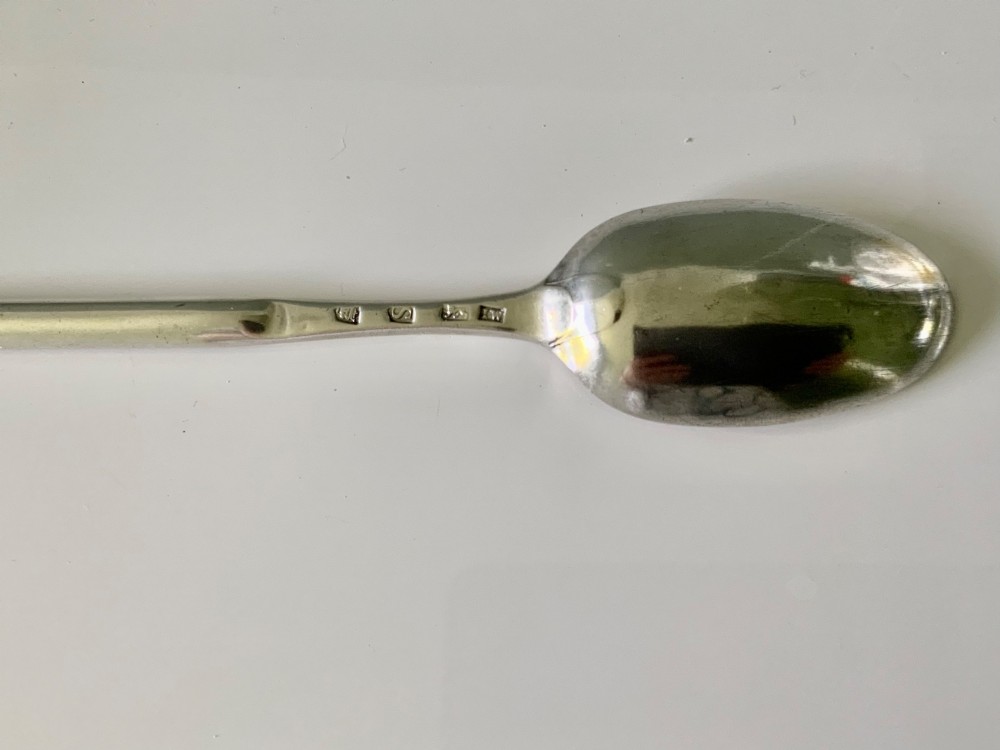 A sterling silver Georgian marrow spoon featuring an oval spoon bowl at one end transitioning into a narrow grooved scoop along the stem. View III