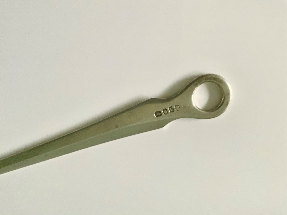 A tapered Georgian sterling silver meat skewer featuring a round ring top terminal and stamped hallmarks. View II