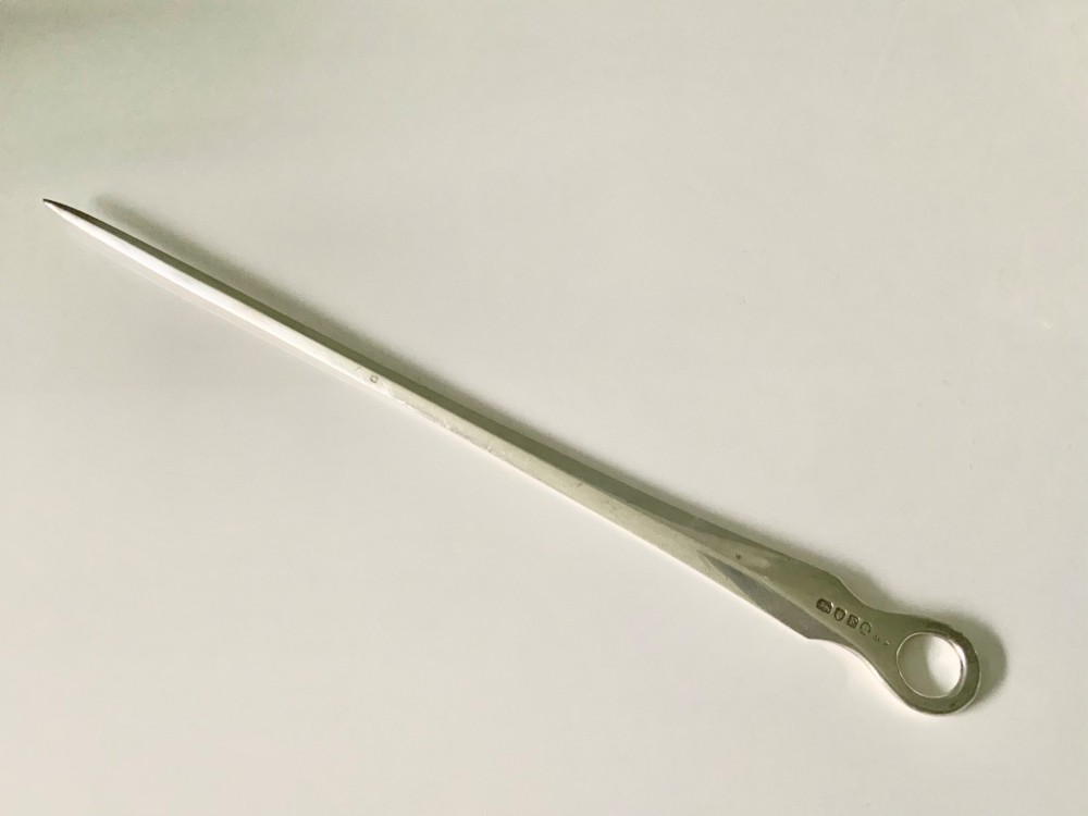A tapered Georgian sterling silver meat skewer featuring a round ring top terminal and stamped hallmarks. View III