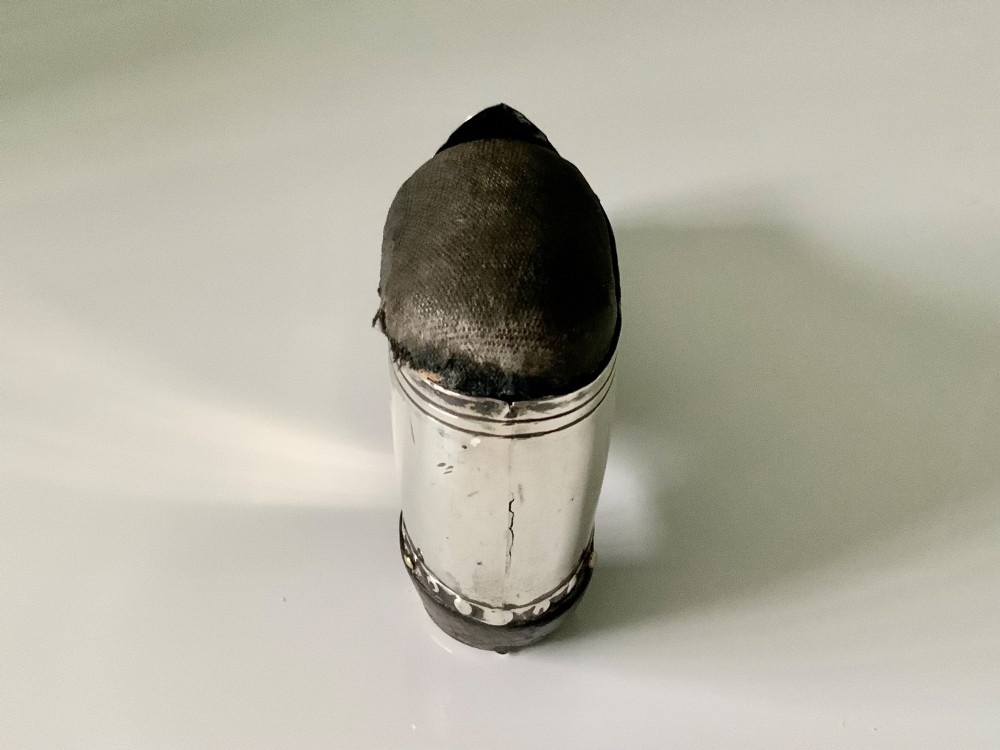 An antique sterling silver pin cushion crafted in the shape of a clog shoe with a dark velvet pad and visible hallmarks. View II