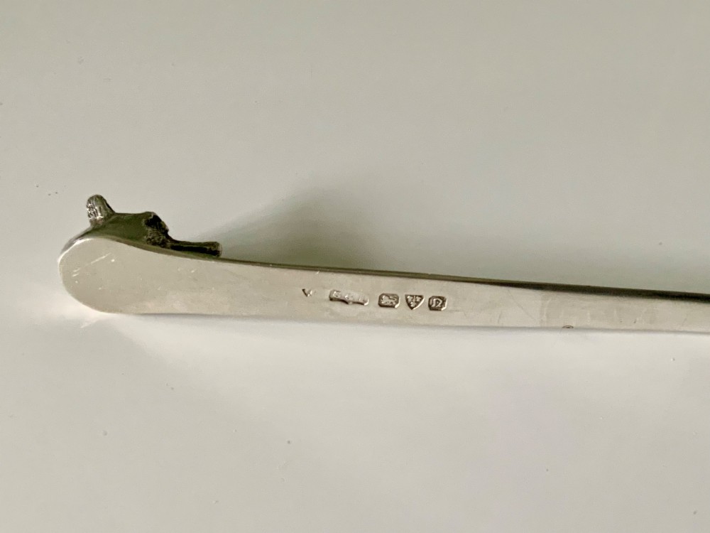 An antique sterling silver letter opener featuring a flat tapered blade and a detailed cast fox head terminal. View III