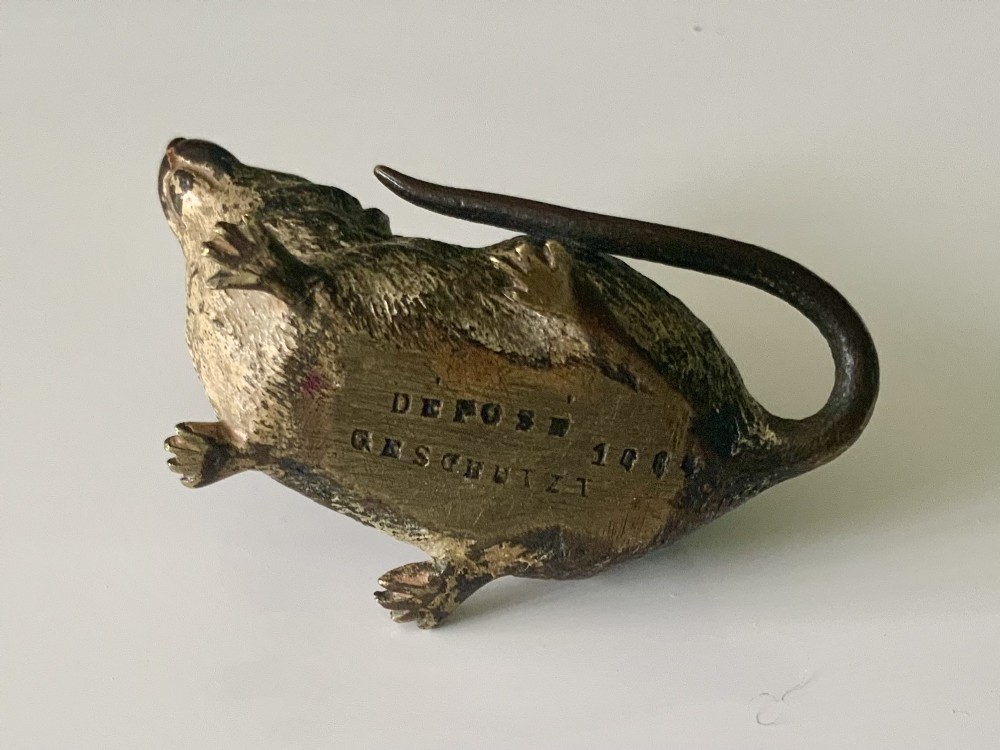An antique Austrian cold-painted bronze figurine of a mouse shown sitting with its tail wrapped around its body. View V