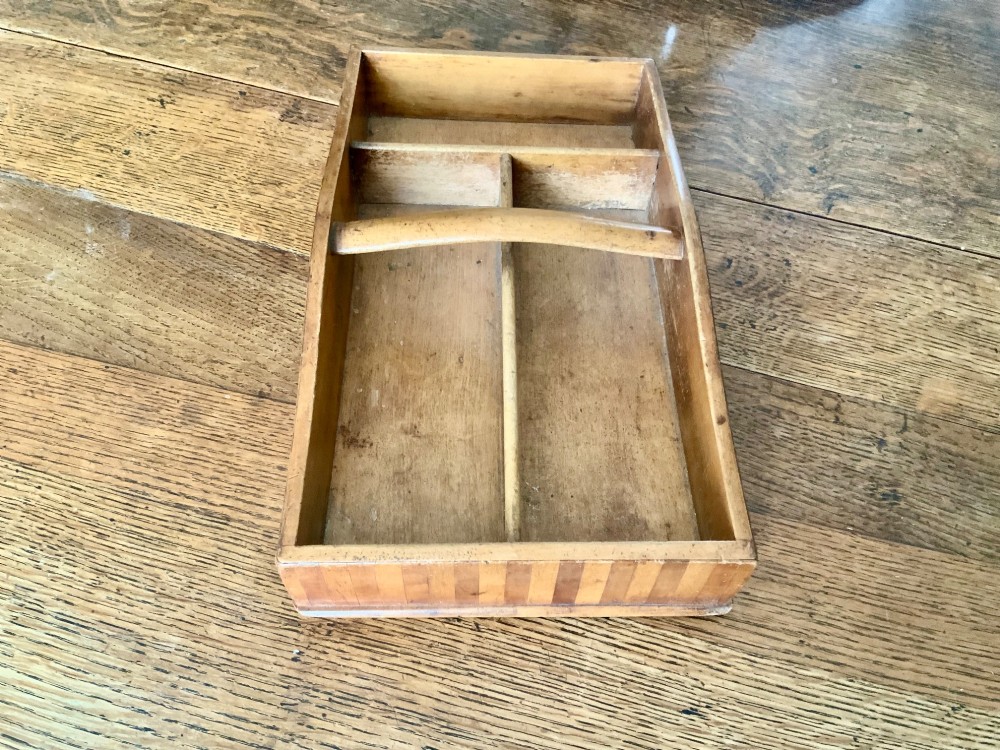 A nineteenth-century Scottish wooden cutlery tray with divided internal compartments, a turned cylindrical handle, and striped timber inlay along the exterior. View V
