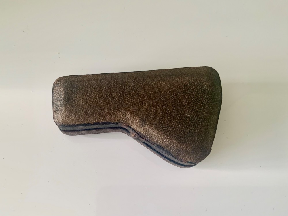 A nineteenth-century engraved brass pocket spectroscope resting inside an open fitted black leather case lined with bright blue velvet. View IV