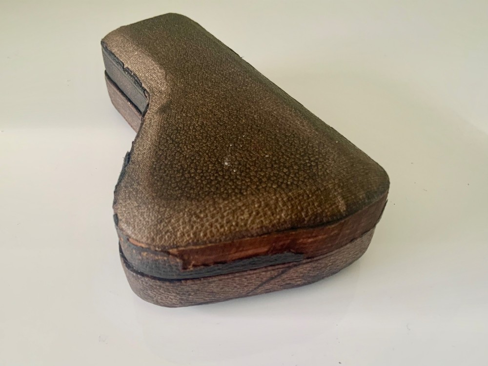A nineteenth-century engraved brass pocket spectroscope resting inside an open fitted black leather case lined with bright blue velvet. View V