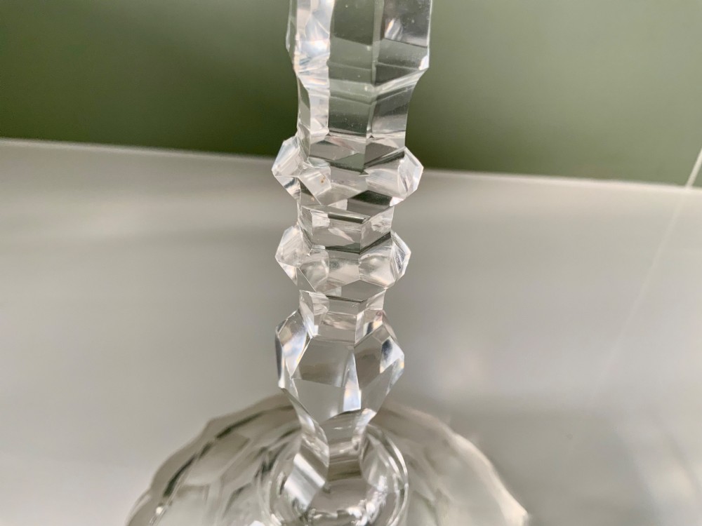 A Georgian clear glass taper stick featuring a faceted knopped stem and a scalloped, facet-cut domed base. View II