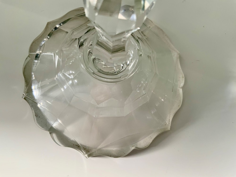 A Georgian clear glass taper stick featuring a faceted knopped stem and a scalloped, facet-cut domed base. View III