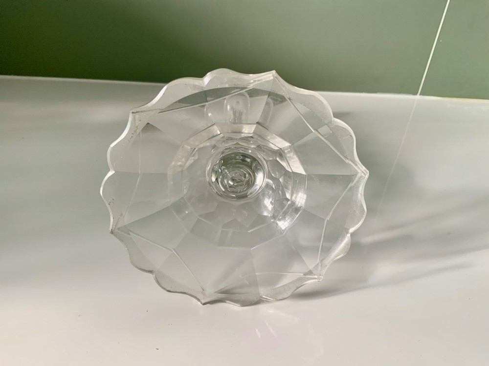 A Georgian clear glass taper stick featuring a faceted knopped stem and a scalloped, facet-cut domed base. View V