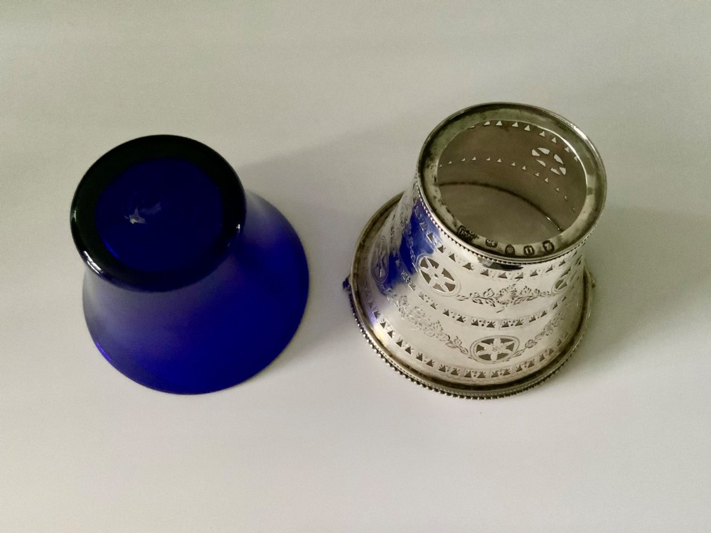 A Georgian sterling silver pierced cream pail featuring bright-cut engraved decoration, an overhead beaded handle, and a removable cobalt blue glass liner. View III