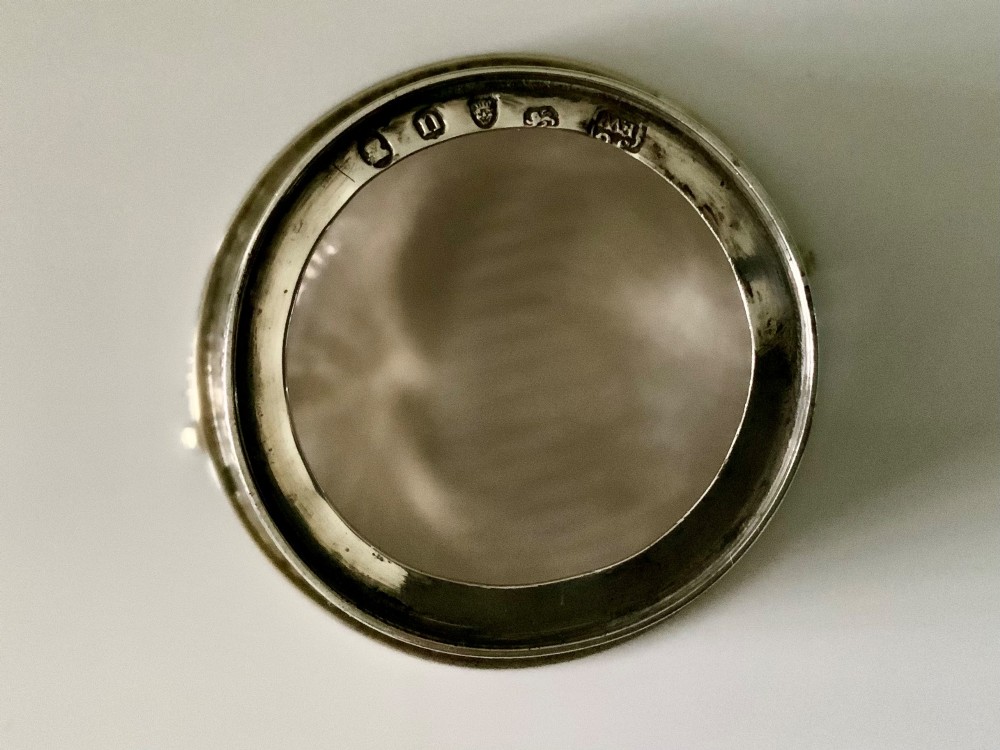 A Georgian sterling silver pierced cream pail featuring bright-cut engraved decoration, an overhead beaded handle, and a removable cobalt blue glass liner. View IV