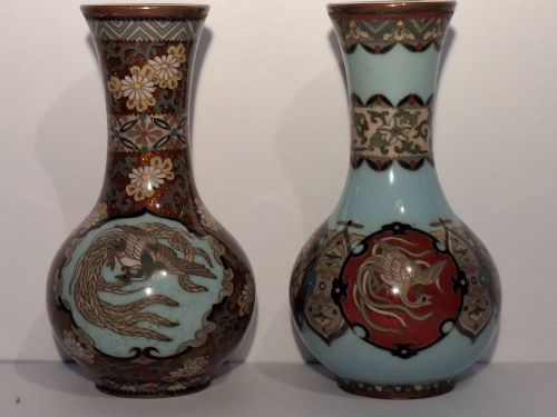 fig 2. A pair of Japanese Meiji period cloisonne enamel miniature vases featuring detailed dragon and phoenix medallions on brown and light blue grounds.